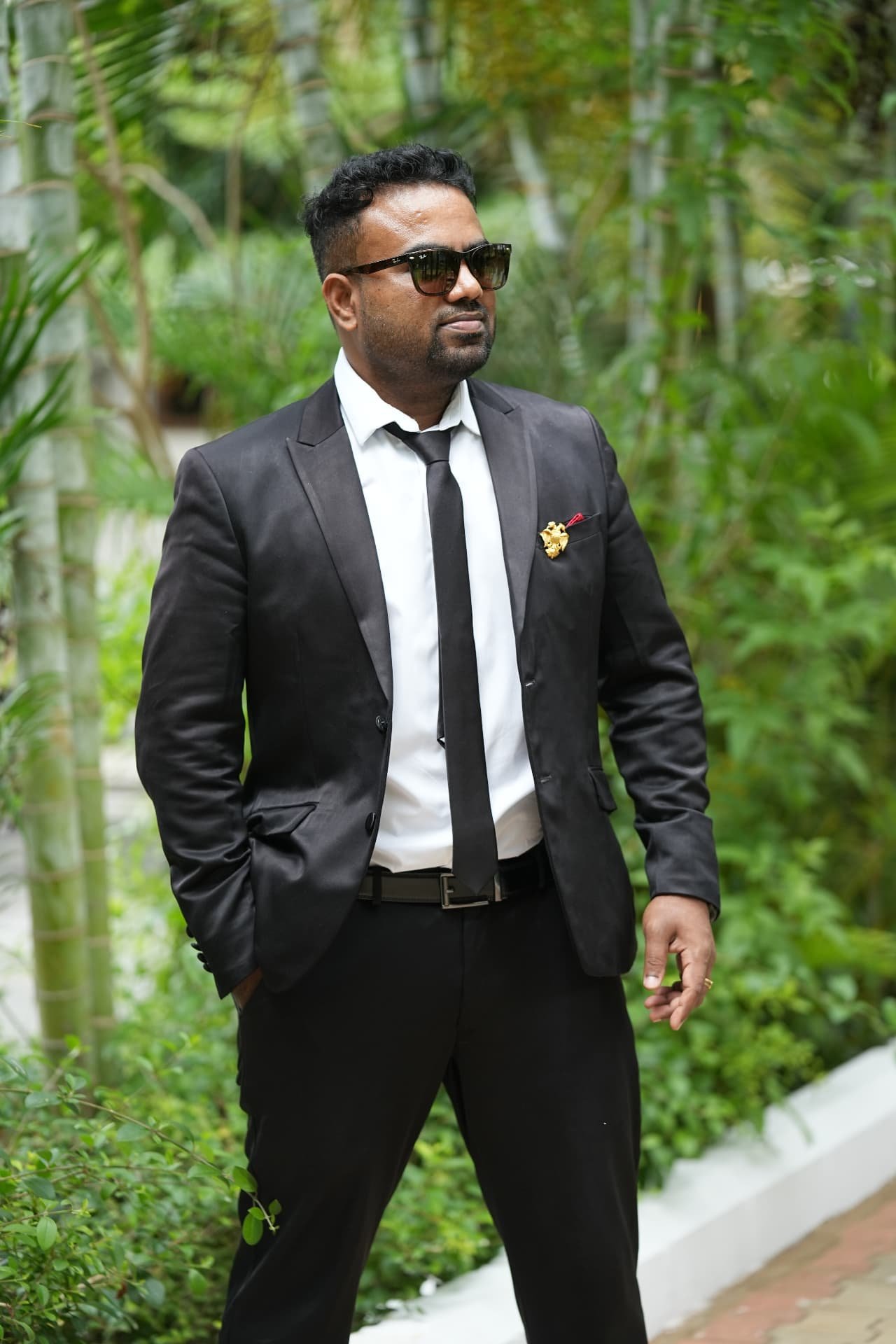 Harri Kumar in a formal black suit, leading with vision